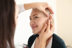 Fitting a new hearing device for a professional woman